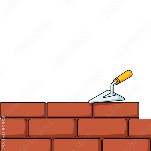Brick wall construction with a trowel tool.