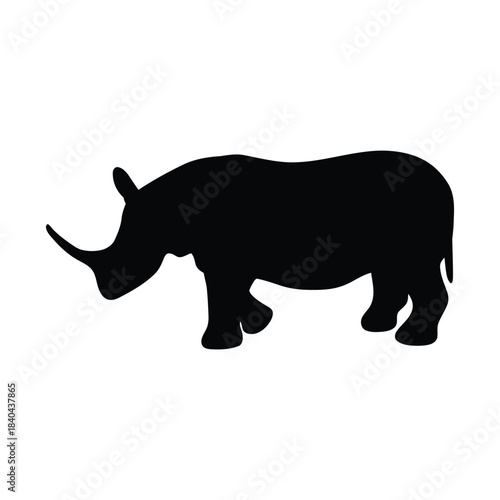 Silhouette of a powerful rhinoceros walking with its horn prominent, symbolizing strength and nature's wild beauty