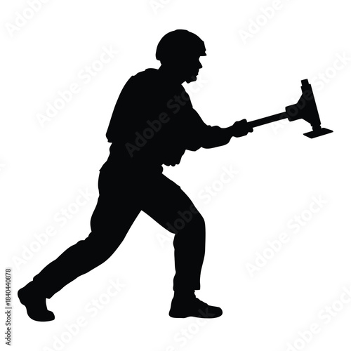 Silhouette of firefighter or rescue worker swinging an axe in action pose