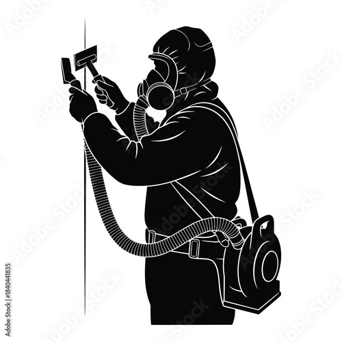 Asbestos removal worker in protective gear spraying wall with hose