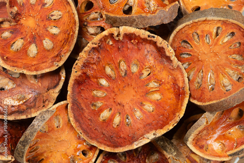 Pile of dried Bael fruit slices for background. Top view