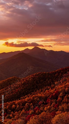 Autumn sunset warm glow on mountain peaks with sunset in autumn mountains above effect nature landscape style featuring mountain