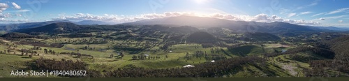 livestock in a meadow, sustainable carbon neutral farming being practiced. regenerative raised cows in a field. agricultural technology innovation.
