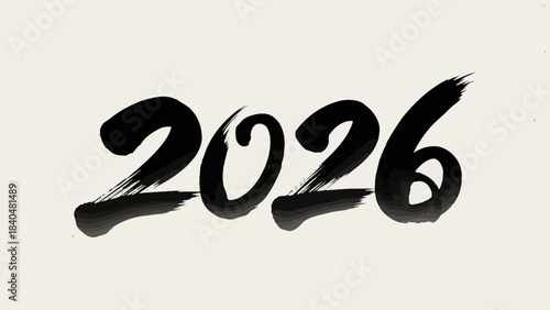 Year 2026 in bold black brush calligraphy representing new beginnings and future planning on a textu