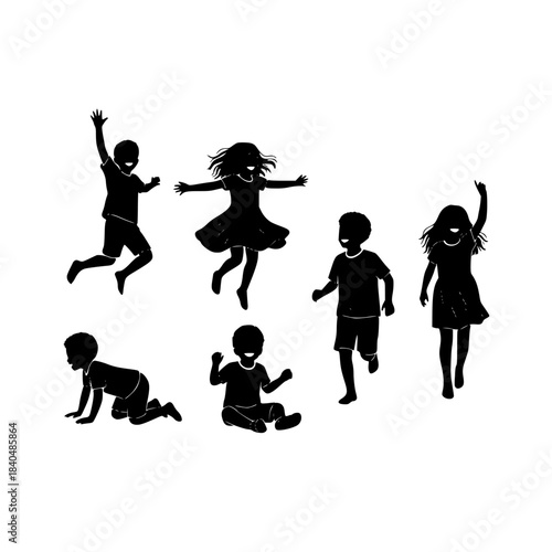 Silhouetted group of children playing together