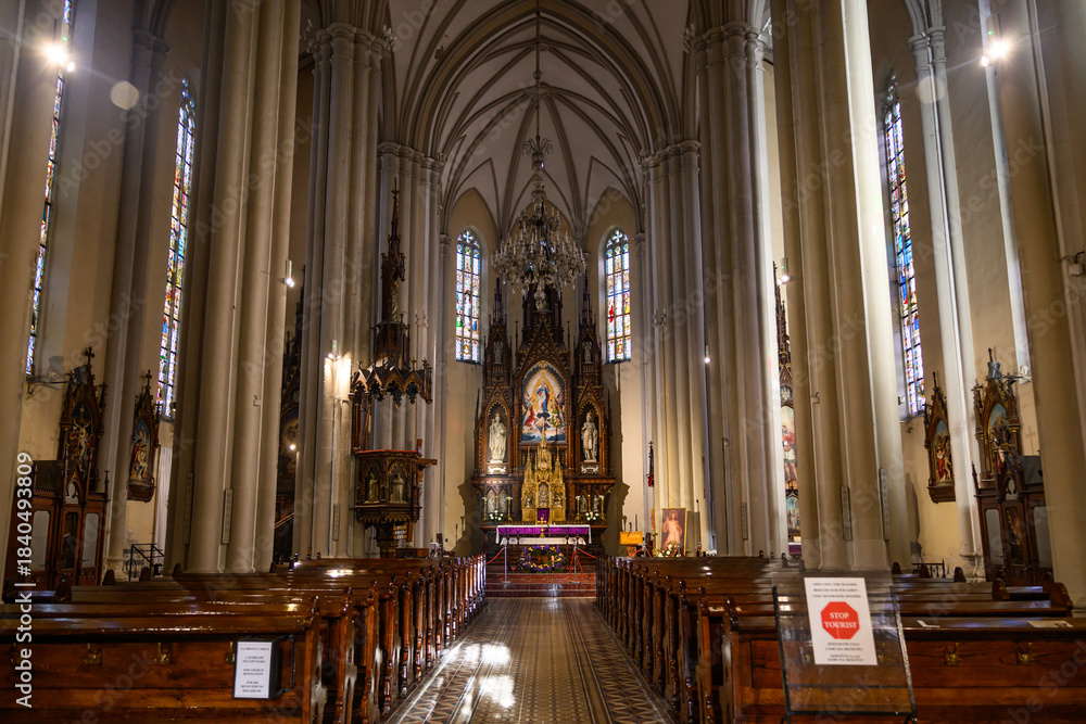 Fototapeta premium Novi Sad, Serbia - Decmber 09, 2025: Interior of the Catholic Cathedral of the virgin Mary at the Central square of the city Novi Sad in Serbia.