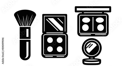 Black and white makeup set - brush, eyeshadow palettes, and compact mirror.