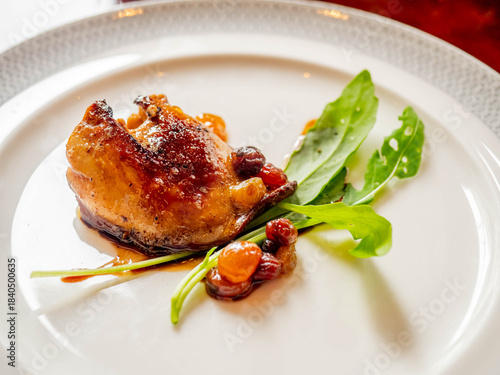 Foie gras, goose liver, grilled with sauce on white dish served in French style in luxury restaurant