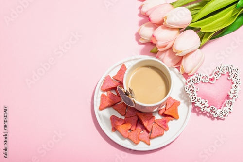 Valentine's Day romantic concept. Morning coffee, a bouquet of tulips, symbolic decor