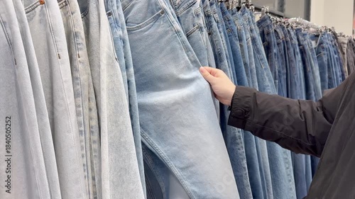 choosing clothes in a shopping mall. clothes hangers