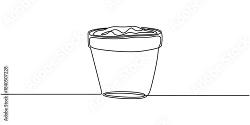 Simple continuous line drawing of a plant growing in a pot. Plant pot continuous one line drawing.