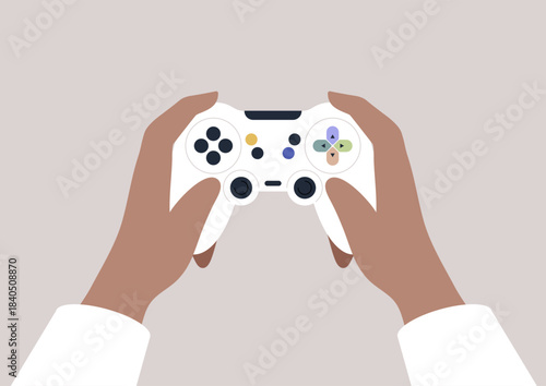 Excitement fills the air as eager hands firmly hold a white joystick, ready to dive into an immersive gaming experience in a comfortable evening atmosphere