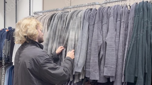 choosing clothes in a shopping mall. clothes hangers
