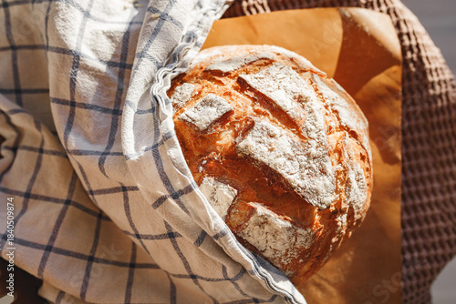 Freshly baked rustic bread wrapped in cloth