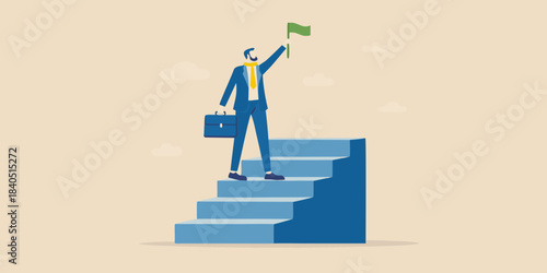 A businessman celebrates success reaching the top of a staircase with a flag