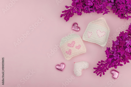 Handmade Valentines Day concept. Creative house figurines, traditional hearts, spring crocheting