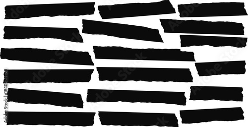 Collection of torn black paper strips on white background