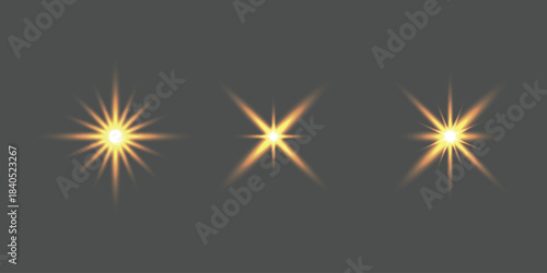 Three bright starbursts on a dark background with a radiant golden glow, light effect set
