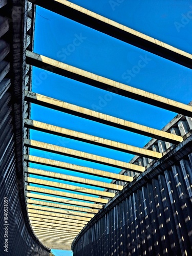 Abstract Geometric Concrete Beams Against Blue Sky