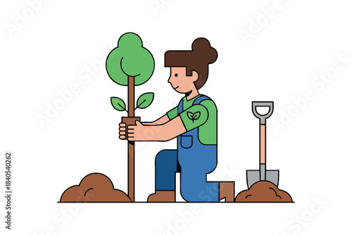A person in blue overalls planting a tree with a shovel nearby