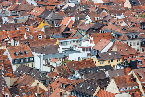 Принти на полотні Scenic aerial view patchwork of Heidelberg red rooftops tiled roofs historical colorful houses medieval old city German Baden-Wurttemberg