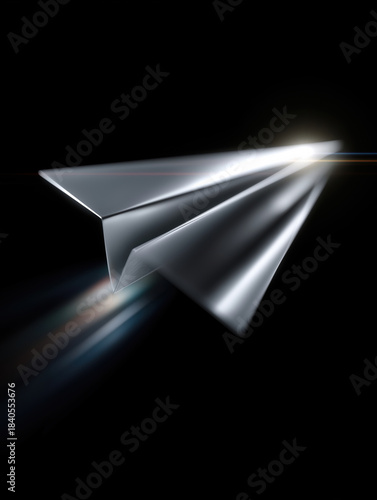 Paper airplane flies through dark space with light trail behind