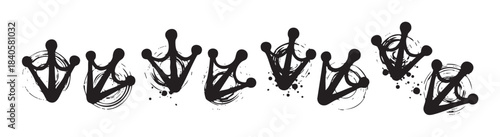 Several artistic grunge crown symbols with ink splatters and expressive brush strokes create a dynamic graphic design element, perfect for creative projects.