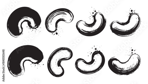 Brush strokes in various stylized cashew shapes and abstract bean forms create a collection of artistic ink elements for design projects.