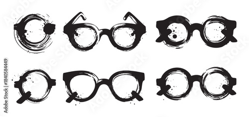 Various eyeglasses illustrations created with artistic black ink brush strokes, showcasing a unique grunge style and diverse frame designs suitable for creative projects.