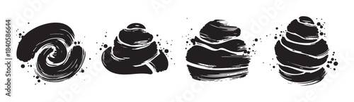 Abstract black ink brush strokes create a dynamic and artistic set of textured graphic elements, perfect for modern design projects.
