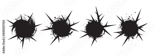 Spiky grunge bursts create a set of abstract ink splatters with a distressed, thorny texture, perfect for graphic design elements.