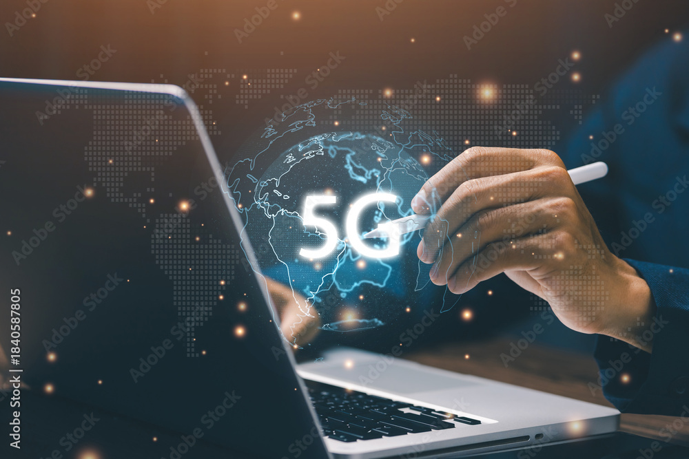 Fototapeta premium Next generation 5G technology concept showing a user interacting with a glowing digital globe displaying 5G, symbolizing ultra-fast connectivity, and advanced mobile communication.