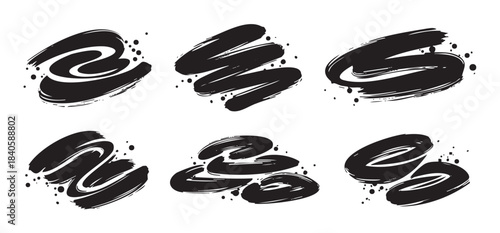 Black brush strokes and ink splatters create a dynamic artistic design element with a hand-drawn, expressive, and grunge texture, perfect for creative projects.