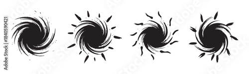 Abstract brushstroke spiral shapes create a set of dynamic black and white grunge design elements with a swirling, energetic motion, perfect for modern graphic projects.