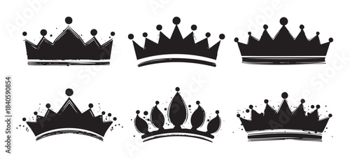 Six black grunge style crowns are presented as a collection of royal symbols, perfect for design elements representing monarchy, success, and achievement.