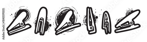 Abstract black and white stylized clips with grunge ink splatters creating a dynamic and artistic graphic design element for various creative projects.