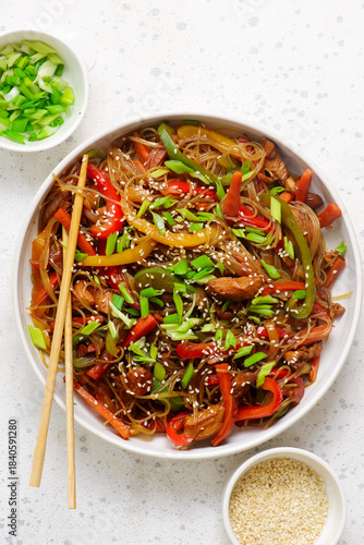Funchoza with chicken and vegetables and teriyaki sauce