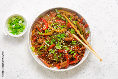 Funchoza with chicken and vegetables and teriyaki sauce