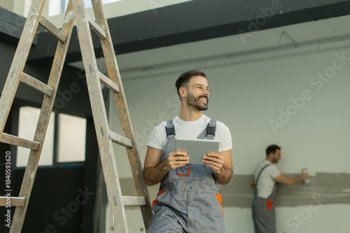 Workers coordinating a reno...