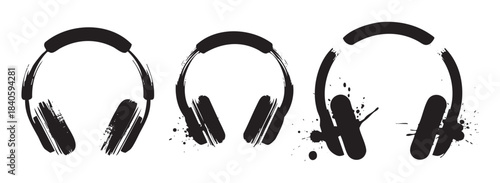 Three artistic grunge style headphones with a distressed ink splatter effect represent music, audio, and sound concepts for creative design projects.