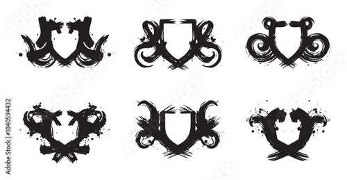 Abstract grunge shields collection featuring various artistic brushstroke designs with a powerful, dynamic, and decorative heraldic aesthetic.