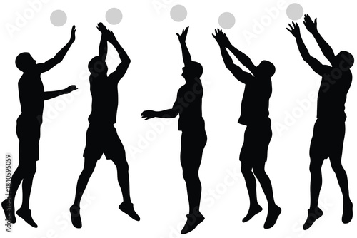 Silhouettes of volleyball players in action jumping and hitting the ball