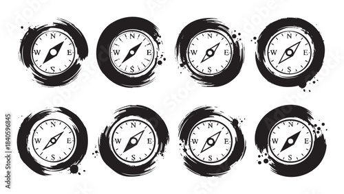 Eight compasses with grunge brushstroke frames represent direction and exploration in a stylized black and white vector illustration set.