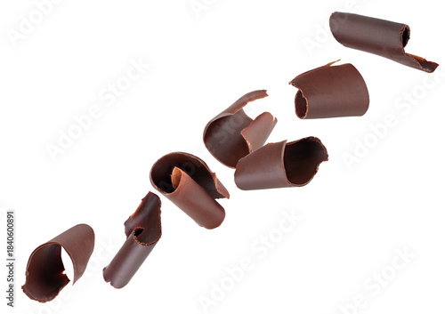 Chocolate curls fly through space, forming a chain. Isolated on white.