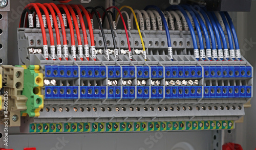Electrical screw terminals for connecting wires in an electrical switchboard. Soft focus. Close-up.