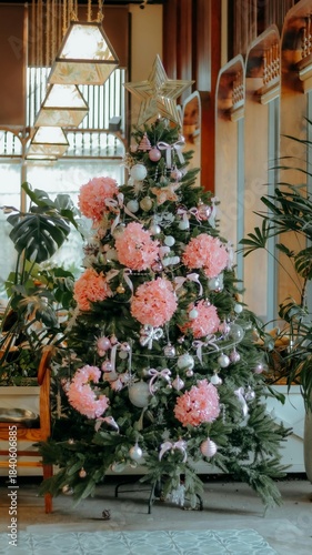 Christmas table setting with a festive flower arrangement near an interior fireplace