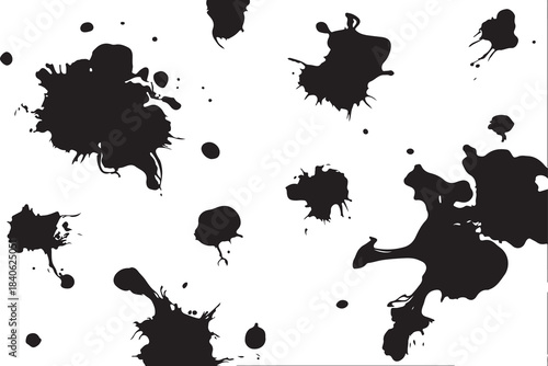 Abstract black ink splashes and paint drops on a white surface