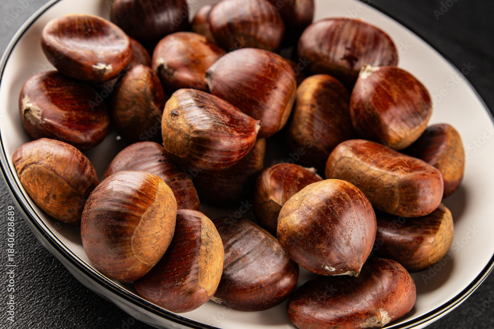 Obraz premium Edible chestnuts delicious treat tasty snack fresh gourmet food background on table rustic food top view copy space