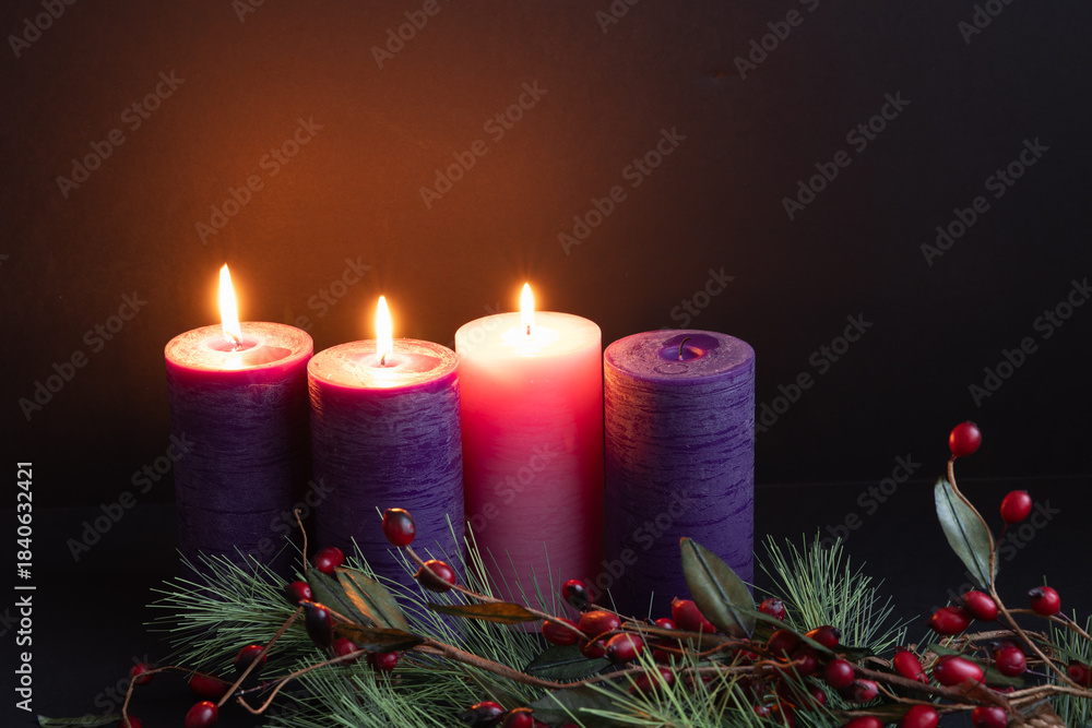 Naklejka premium Three advent candles burning in the darkness with evergreen border