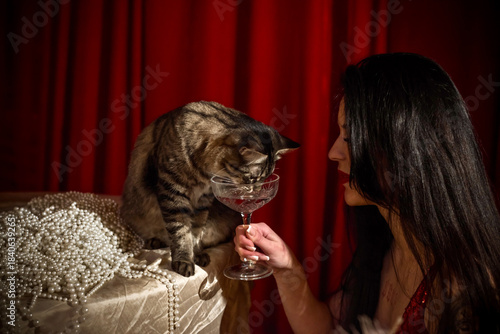 Gorgeous brunette European woman in sparkle red dress at party, fashionable concept